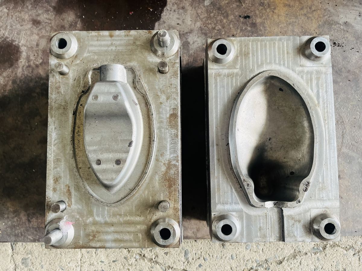 Two halves of the aluminium shoe tree mould